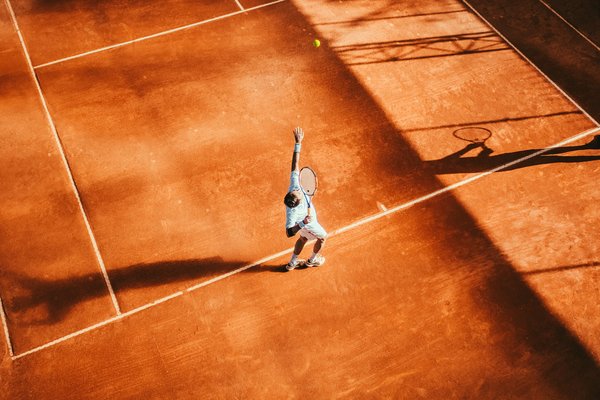 How can UK tennis clubs improve their court surfaces to reduce player injuries?